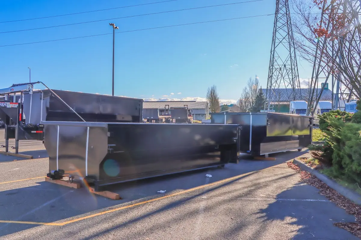 Roll-off dumpster ready for waste disposal at job site for Concrete Dumpster Rental in Jackson